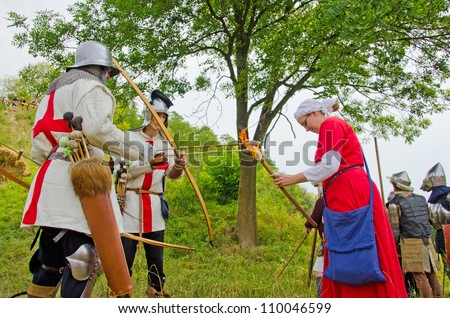 STRONSKO, POLAND - AUG 5: historical reconstruction of attacking a Medieval village during the First Knights Tournament for the prize of Zapolice Mayor,  August 5 2012, Stronsko, Poland