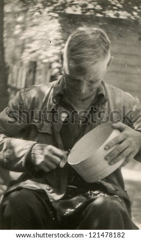 Vintage photo of artisan making a wooden sifter (sixties)