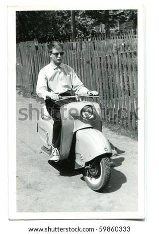 Vintage photo of young man on scooter (fifties/sixties)