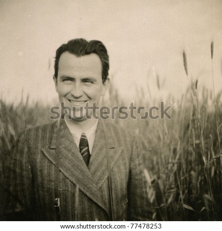 Vintage photo of smiling man (forties)