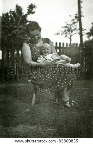 Vintage photo of mother and baby daughter (fifties)