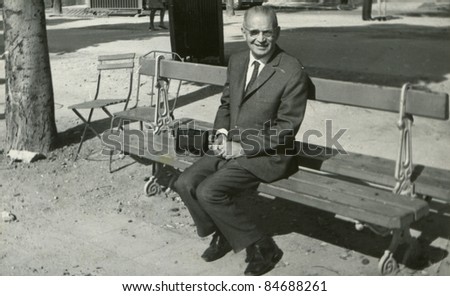 Vintage photo of man on bench (fifties)