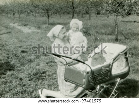 Vintage photo of grandmother with baby grandson (early eighties)
