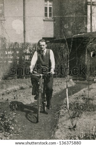 Vintage photo of man on bike, forties