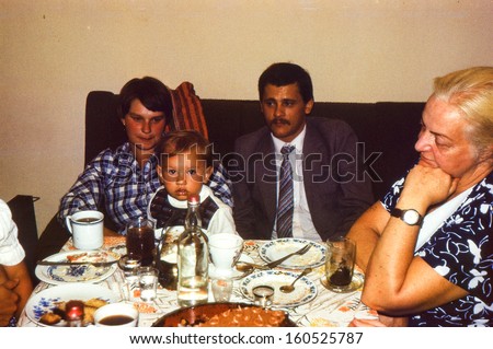 Vintage photo (scanned reversal film) - family dinner, early eighties