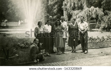 LODZ,POLAND, CIRCA FIFTIES -  unidentified big family members posing outside, in the garden - circa fifties