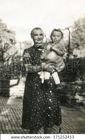 BIELSKO, POLAND, CIRCA FORTIES -vintage photo of grandmother with granddaughter