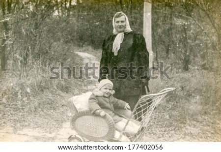 POLAND, CIRCA FORTIES - Vintage photo of grandmother with baby granddaughter