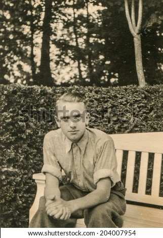 GERMANY, CIRCA FORTIES - Vintage portrait of man on bench