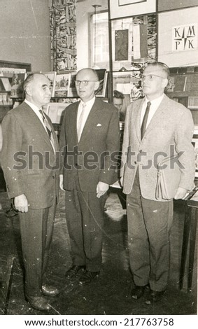 POLAND, CIRCA FIFTIES - Vintage photo of three men in formal suits