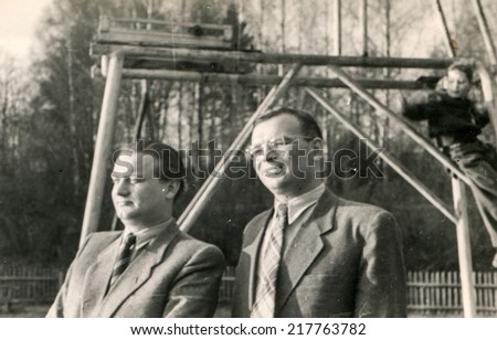LODZ, POLAND, CIRCA FIFTIES - Vintage photo of two men outdoor