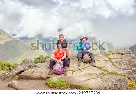 MACHU PICCHU, PERU - MAY 3, 2014 - group of tourists after climbing Huayna Picchu mountain