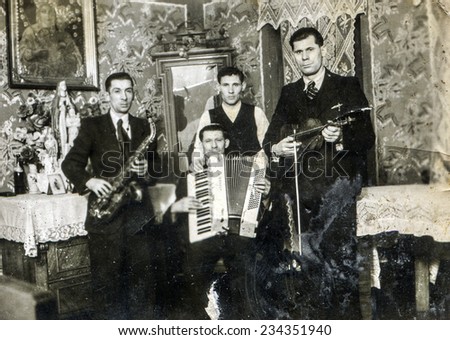 GERMANY, CIRCA 1920s: Vintage photo of group of men with musical instruments