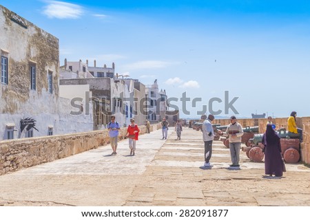 AS-SAWIRA, MOROCCO, APRIL 7, 2015: Local people and tourists walk on ramparts of Skala de la Ville
