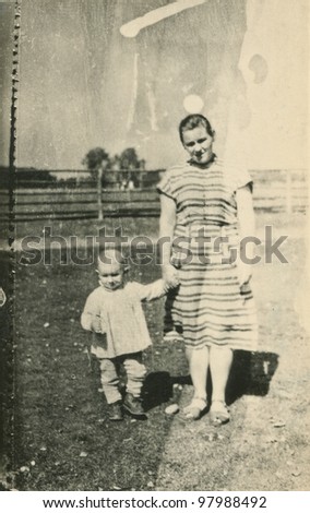 Vintage photo of mother and daughter (fifties)