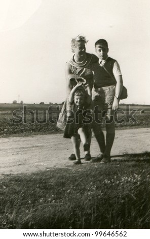Vintage photo of mother, son and daughter - fifties
