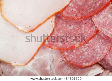 Cutting cured meat on a celebratory table
