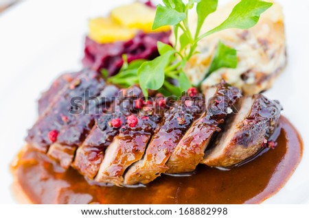 Duck breast on orange sauce with red cabbage and gratin dauphinoise