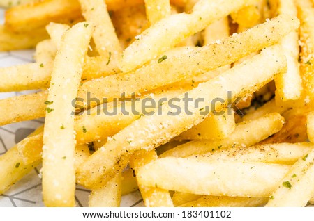 Close up French fried in black dish using as background