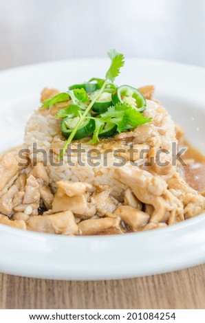 Chicken with brown sauce on rice