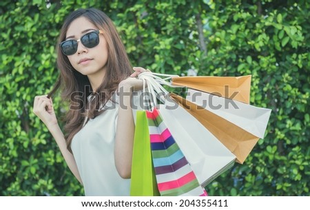 Girl with shopping bag. Process vintage style picture