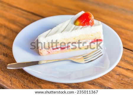Strawberry cream cakes on white plate