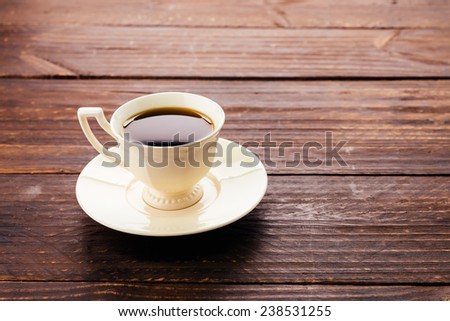 Coffee mug on wood background - Vintage effect style pictures