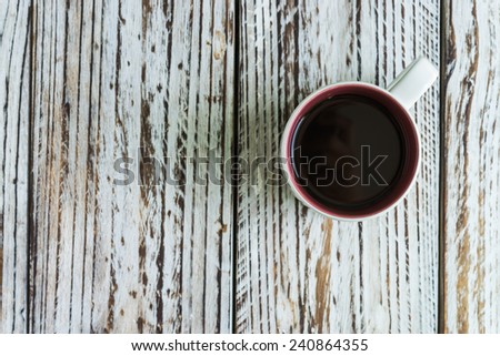 White coffee mug on wood background