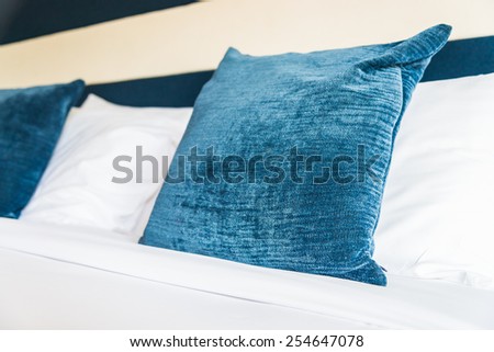 Bed pillow in luxury hotel - vintage film tone effect style processing