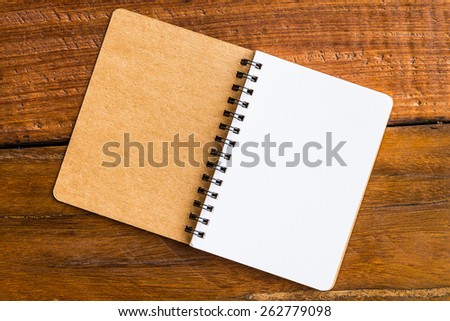 Note book paper on wooden background - Vintage effect style pictures