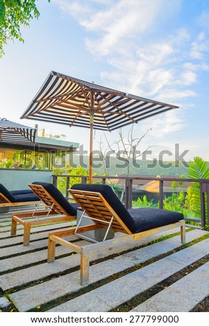 Umbrella pool chair on roof top