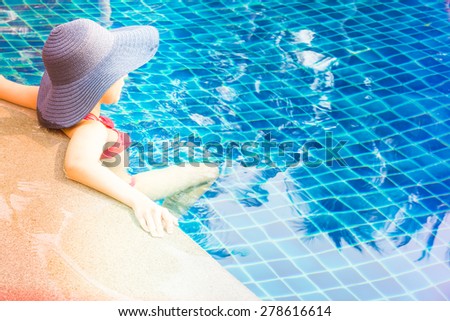 Woman in swimming pool - vintage filter and light leak effect processing