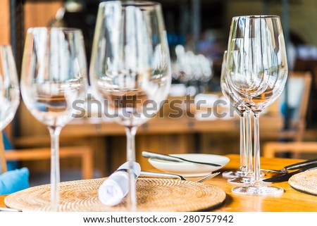 Selective soft focus on Wine glass on dining table in restaurant