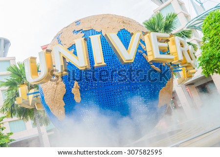 SINGAPORE - August 6: Tourists and theme park visitors taking pictures of the large rotating globe fountain in front of Universal Studios on August 6, 2015 in Sentosa island, Singapore