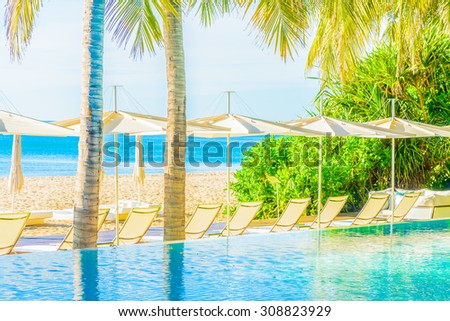 Beautiful luxury hotel pool resort nearly beach - Bright light processing style