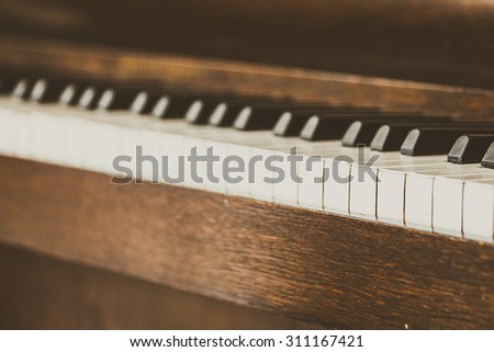 Selective focus point on Old vintage piano keys - vintage filter effect