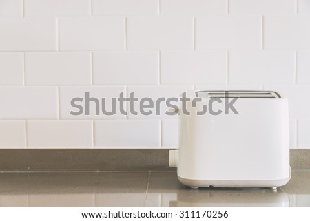 Bread toaster at kitchen - light vintage tone filter effect