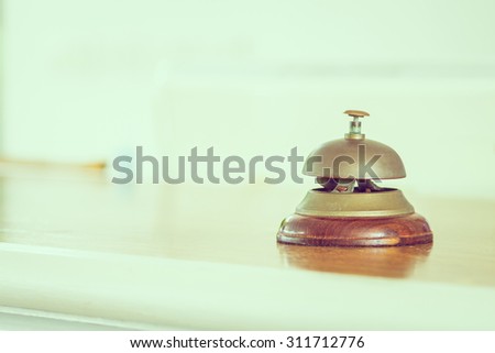 Vintage service bell at hotel reception - vintage filter