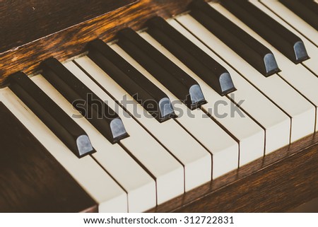 Selective focus point on Old vintage piano keys - vintage filter effect