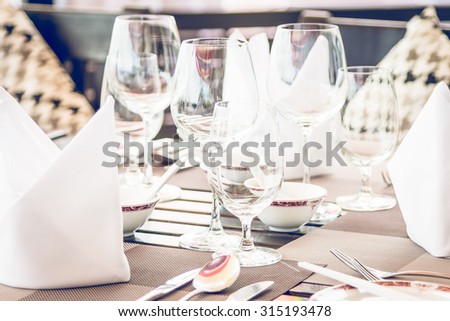 Table dining set in the hotel restaurant - light vintage filter effect processing style pictures - Selective focus point