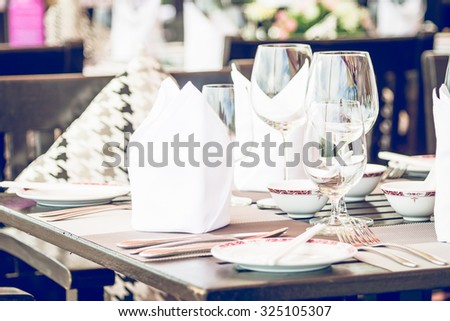 Table dining set in the hotel restaurant - light vintage filter effect processing style pictures - Selective focus point