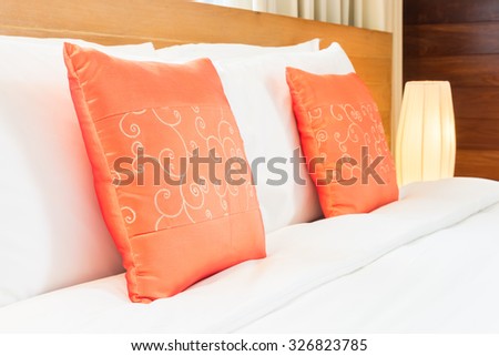 Beautiful luxury bedroom interior with orange pillow decoration in hotel resort
