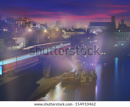 Kiev sunset on the Dnieper River, overlooking the River Station and the entire Podol, a transport line, old and new houses Roman Mikhailyuk