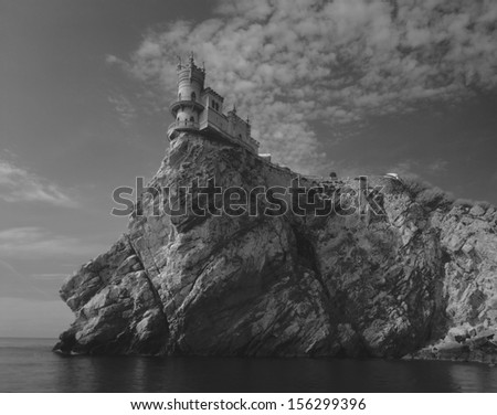 Black and white photographs of beautiful ancient building in the Crimea, Ukraine. On  huge rock is a house, the castle of the original European Gothic, new gothic style of architecture. Retro, vintage