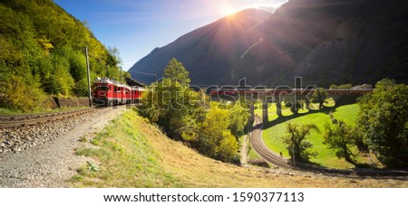 Similar – Image, Stock Photo Train on bridge amid lush plants in mountains