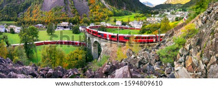 Similar – Image, Stock Photo Train on bridge amid lush plants in mountains