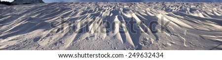 very mysterious and fantastic at sunrise, sunset and moonlight snow space of high mountains Ukraine- Ukrainian Carpathians, carved by the winds, blizzards, storms and snowfall in decorative patterns