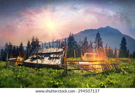 High in the mountains of the shepherds of sheep and cows build home- seekers and summer graze cattle in wild fields and forests of the Carpathians. Night pasture fantastically fabulous