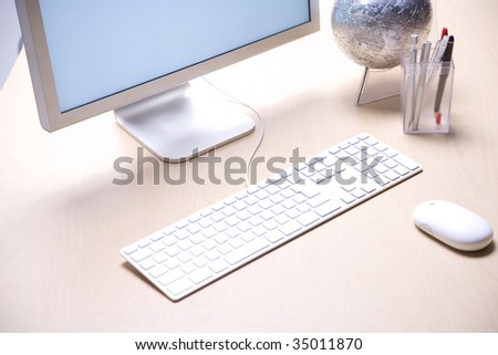 BUSINESS IMAGE-a PC desktop and a stationary box on the desk