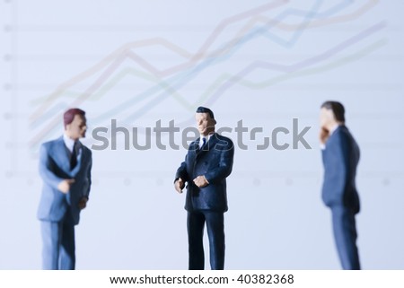 The businessmen who line up before a chart.